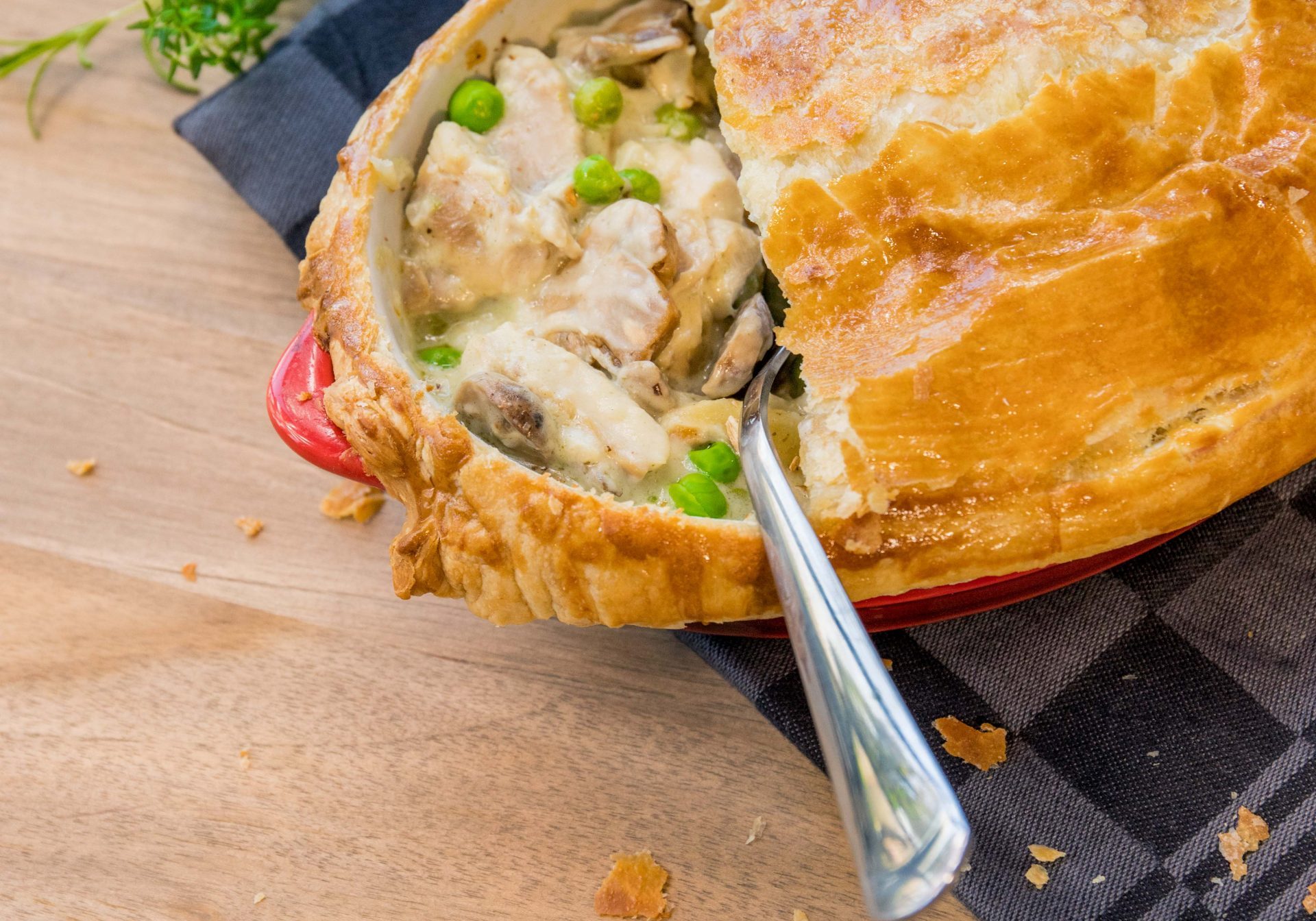 Pie with mushrooms and peas with a spoon